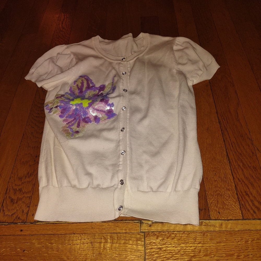 White short sleeve cotton cardigan with purple sequin flower design fits small